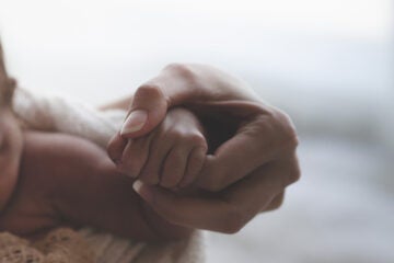Close up of a woman holding her baby