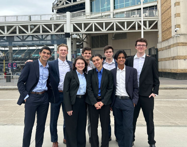 Photo of students posing in front of Progressive Field ahead of a presentation