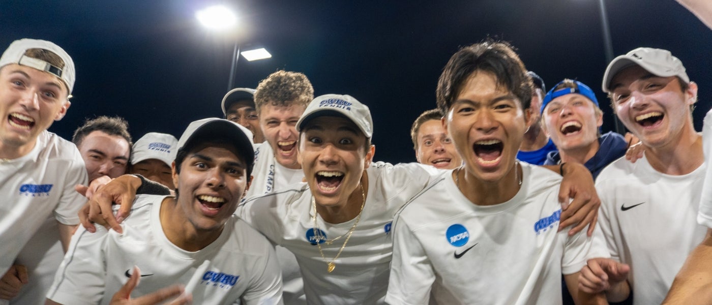 Excited men's tennis team. Photography by Sofiia Briantseva.